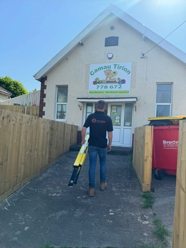 AS Fire engineer arriving on site at a day nursery to carry out a BS 5839 fire alarm installation.