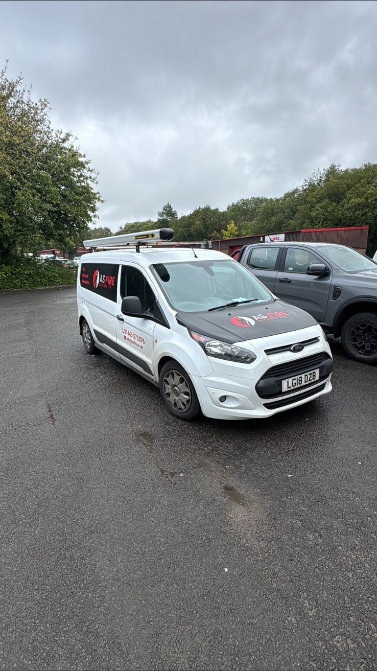 AS Fire Services Ltd engineer van on a commercial site in South Wales during a fire safety visit.